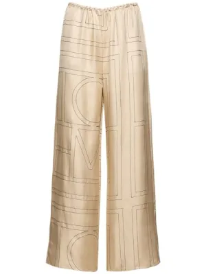Toteme   Monogram embroidered silk pants 